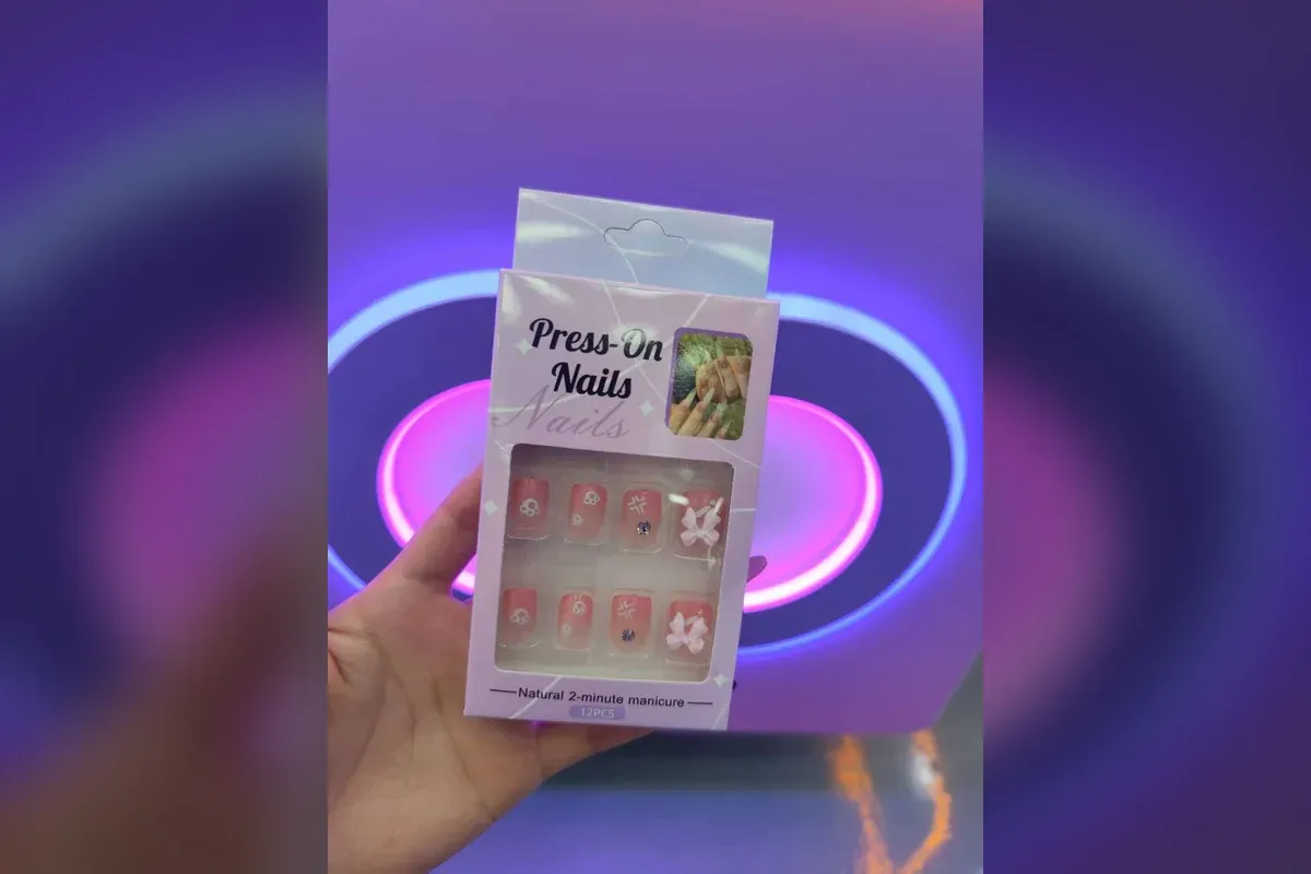 Packaged ready-made press-on nail kit dispensed by the CT-MJ330